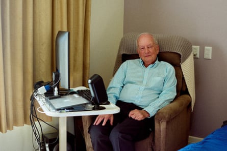 Andrew McKean in a chair in his room