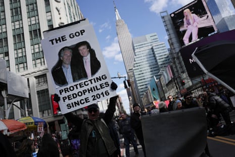 A demonstrator holds a sign.