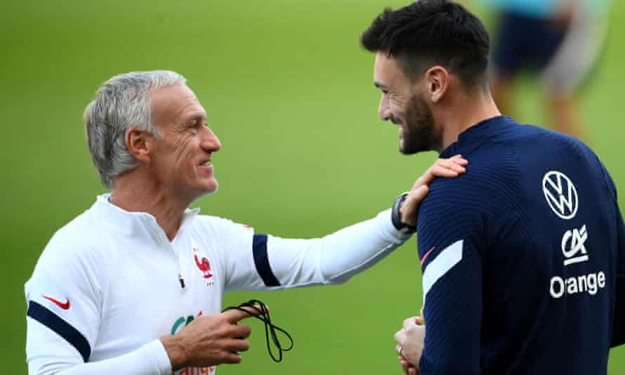 Didier Deschamps with Hugo Lloris at a training in Turin for Sunday night’s final against Spain