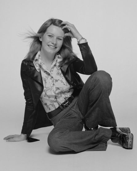 Fiona Cottrell sits on the floor as she poses for a photograph