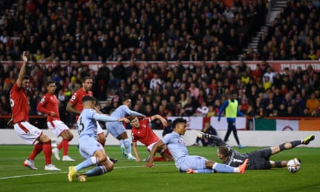 Ollie Watkins of Aston Villa slides in to stick the ball past Nottingham Forest keeper Dean Henderson but he is denied a goal by the raising of an offside flag.