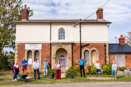 The volunteer gardeners at the back of the old station house.