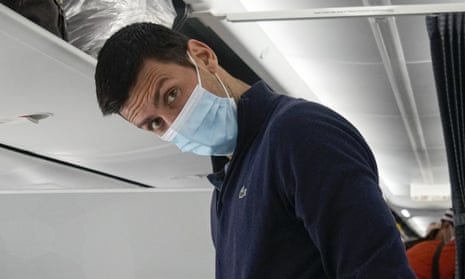Novak Djokovic prepares to take his seat on a plane to Belgrade, in Dubai, United Arab Emirates, Monday, Jan. 17, 2022.