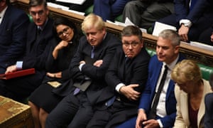 Boris Johnson at the House of Commons sitting amid other MPs