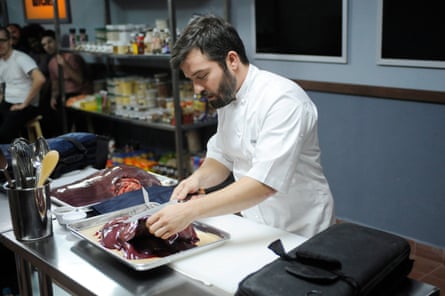 cook preparing meat