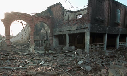 A Russian soldier inspect the ruins of the house of the then Chechen president, Aslan Maskhadov, in Grozny in January 2000.