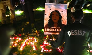 Protesters light candles and lay flowers outside the Federal Courthouse in remembrance of Breonna Taylor in Seattle, Washington.