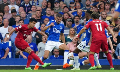 Everton footballers, in Stake.com shirts, playing Liverpool