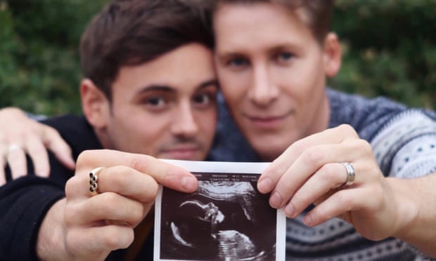Tom Daley and husband Dustin Lance Black posted a photograph of themselves holding up a baby scan on social media.
