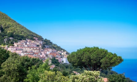 View of the historical centre of Maratea on a green mountain overlooking the sea, Basilicata region, Italy.