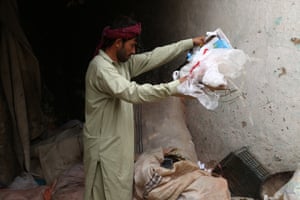 A man sorts through rubbish
