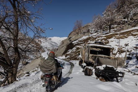 A destroyed army vehicle sits by the roadside in Panjshir’s Hezarak district