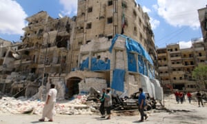 People inspect the damage at the Médecins Sans Frontières hospital in Aleppo, Syria.