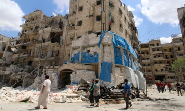 People inspect the damage at the Médecins Sans Frontières hospital in Aleppo, Syria.