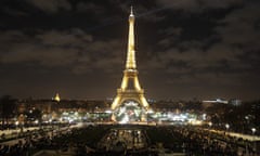 Crowds are seen at the Eiffel Tower during New Year’s celebrations in Paris on December 31, 2017. / AFP PHOTO / Zakaria ABDELKAFIZAKARIA ABDELKAFI/AFP/Getty Images