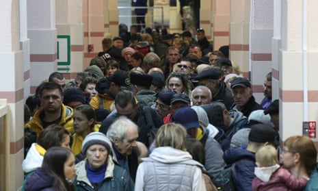 Civilians evacuated from the Russian-controlled Kherson region arrive at a railway station in Crimea