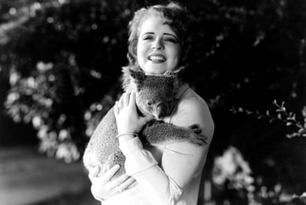 Clara Bow with her pet koala, 1931.