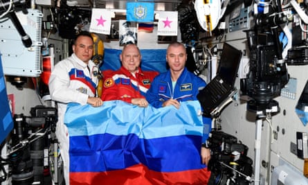 Russian cosmonauts pose with a flag of the self-proclaimed Luhansk People’s Republic at the International Space Station.