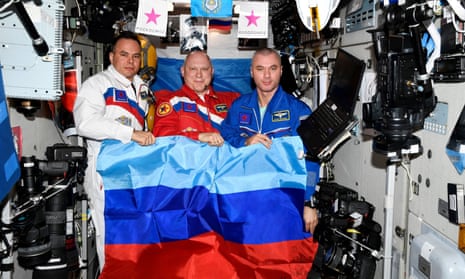 Russian cosmonauts pose with a flag of the self-proclaimed Luhansk People’s Republic at the International Space Station in July 2022