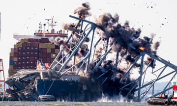 Part of a bridge collapses during a controlled demolition.