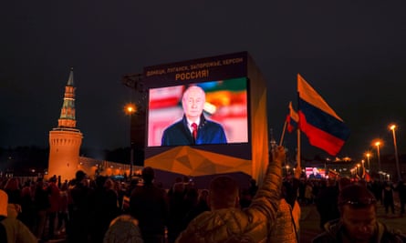 A TV screen shows live broadcast of Russian President Vladimir Putin delivering his speech to people after a ceremony to sign treaties on new territories’ accession to Russia in downtown of Moscow, Russia, 30 September 2022.