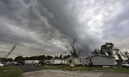Dark clouds hang over Bradley Lane after a tornado destroyed several mobile homes in New Iberia, Louisiana Wednesday.