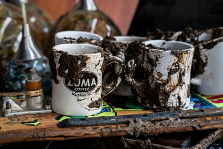 Muddied mugs in a cafe.
