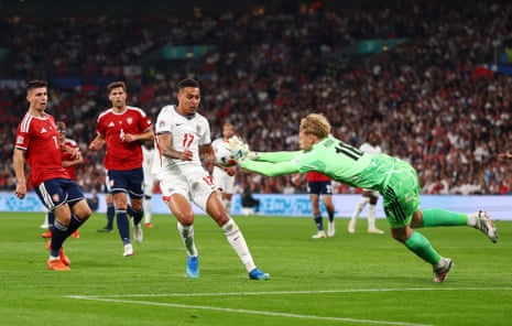 Czechia's keeper Lukas Horníček pushes the ball away from England's Morgan Rogers.