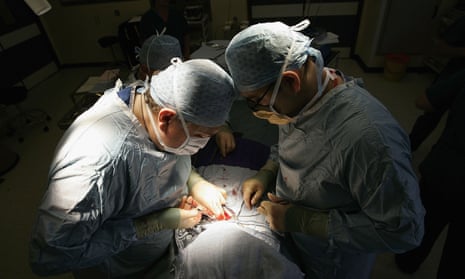 Surgeons conduct an operation