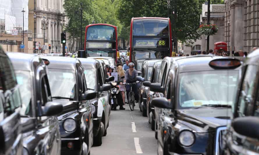 Black cab and licensed taxi drivers protest the introduction of Uber in London, June 2014.