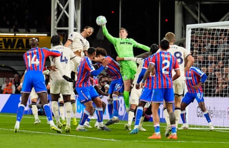 Dean Henderson punches the ball on his way to a clean sheet for Crystal Palace.