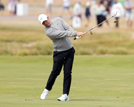 Rory McIlroy plays a changeable connected nan eighth spread during nan first information of nan US Open astatine Shinnecock Hills Golf Club