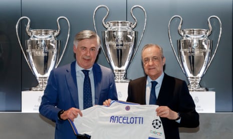 Carlo Ancelotti poses with the Real Madrid president, Florentino Pérez, at the manager’s official unveiling.