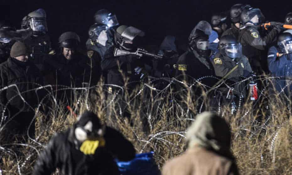 Police confront protesters near the Standing Rock Indian Reservation, North Dakota, 20 November, 2016. 