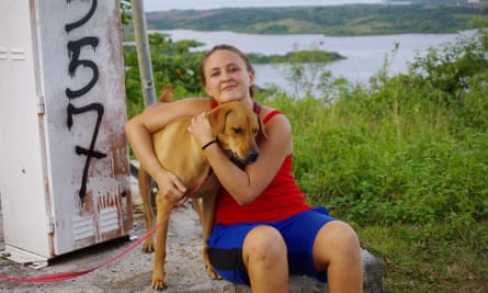 Rachelle Bergeron with one of the couple’s dogs, Nubs, in Yap. Nubs was not the dog that was killed in the shooting.