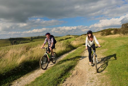 A young adult couple cycling along the South Downs Way at Butts Brow, Willingdon, near Eastbourne, East Sussex. UK Image Ref EA9YP4 (RM) Contributor parkerphotography Credit line parkerphotography / Alamy Stock Photo Location “Butts Brow” Willingdon “South Downs Way” “south Downs” Eastbourne Date taken 2 September 2014