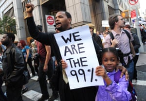 Protesters with ‘We are the 99%’ placard during Occupy Wall Street.