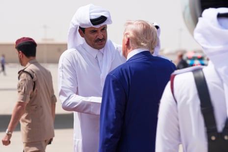 Qatar's emir Sheikh Tamim bin Hamad Al Thani bids farewell to President Donald Trump at al-Udeid airbase in Doha, Qatar.