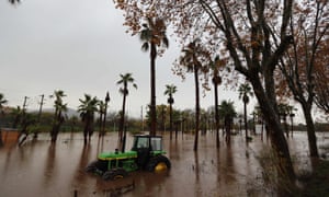 A tractor in a flooded area after heavy rain in Roquebrune-sur-Argens, France.