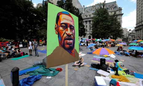 An image of George Floyd is seen at a protest to defund police in New York City on 26 June 2020. 