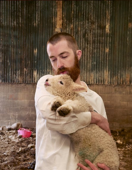 Fendrix holds a lamb in his arms