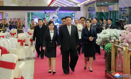 Staff clap at a banquet attended by the Kim family in Pyongyang.