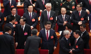 Chinese President Xi Jinping waves as he leaves after the closing of the 19th Communist Party Congress at the Great Hall of the People in Beijing, China.