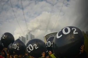 Activists hold giant balloons labelled CO2 in front of the Neurath coal power plant during protests prior to talks. 2017 is set to be one of the hottest three years on record, provisional data suggests, confirming yet again a warming trend that scientists say bears the fingerprints of human actions.