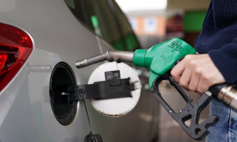 Man fills car at a petrol station