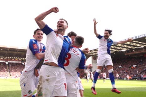 Szmodics celebrates with teammates after scoring.