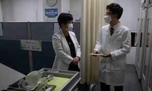 Medical workers prepare for the vaccination rollout at a public health centre in Seoul.