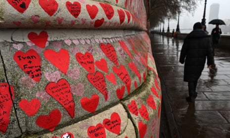 Red hearts  been painted on the National Covid memorial wall opposite the Houses of Parliament to commemorate each life lost in the UK due to the Covid pandemic.