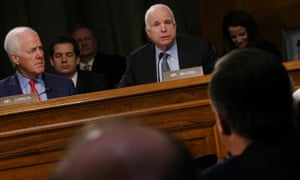 U.S. Senator John McCain questions Representative Mike Pompeo as he testifies before a Senate Intelligence hearing on his nomination to head the CIA on Capitol Hill in Washington January 12, 2017.