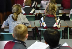 Children sit in a classroom during a lesson at Stafford State School in Brisbane, Wednesday, Aug. 5, 2015.